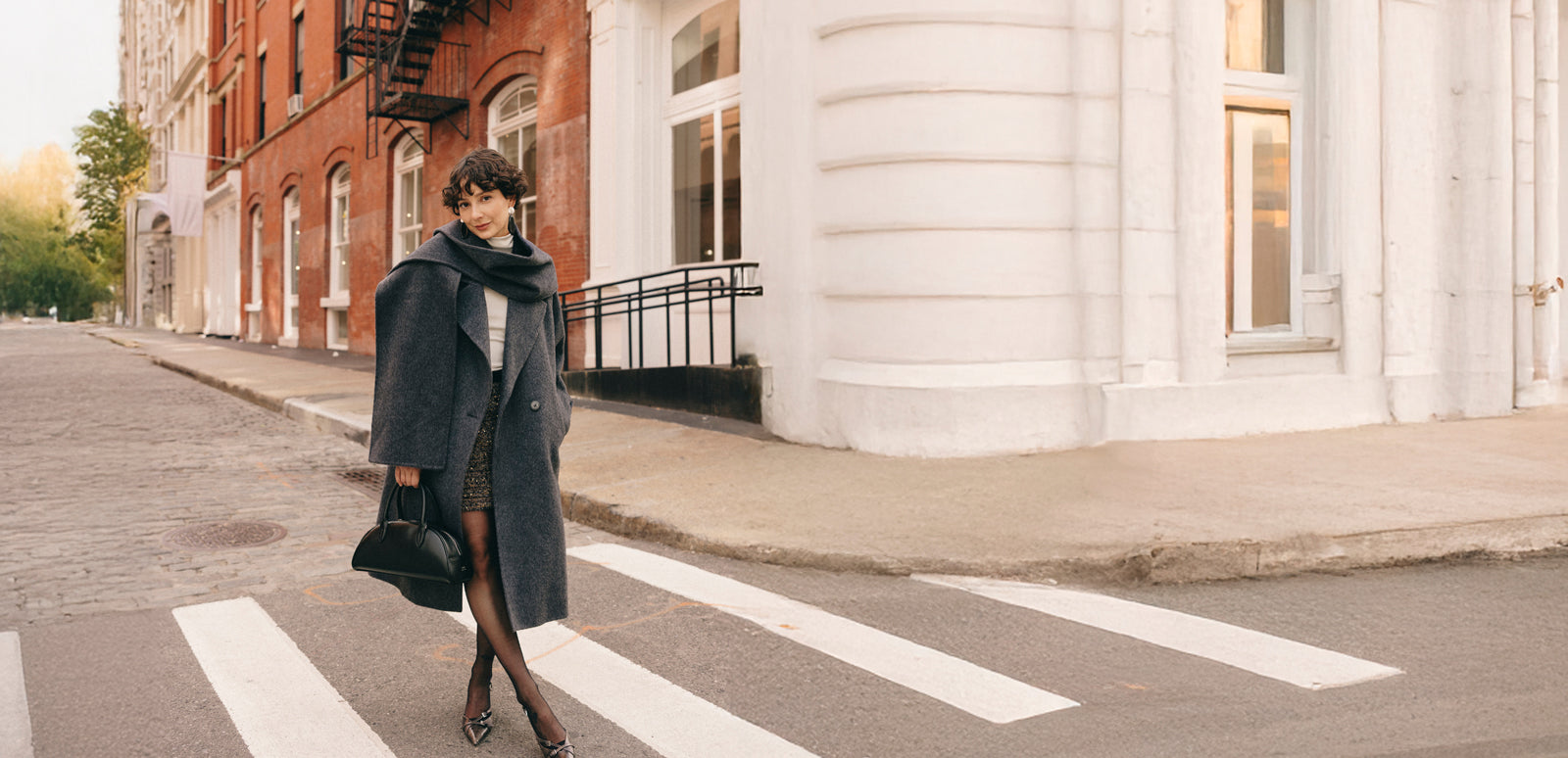 Model in NYC wearing Petite Studio winter coat